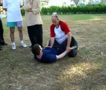 old man pushes cart